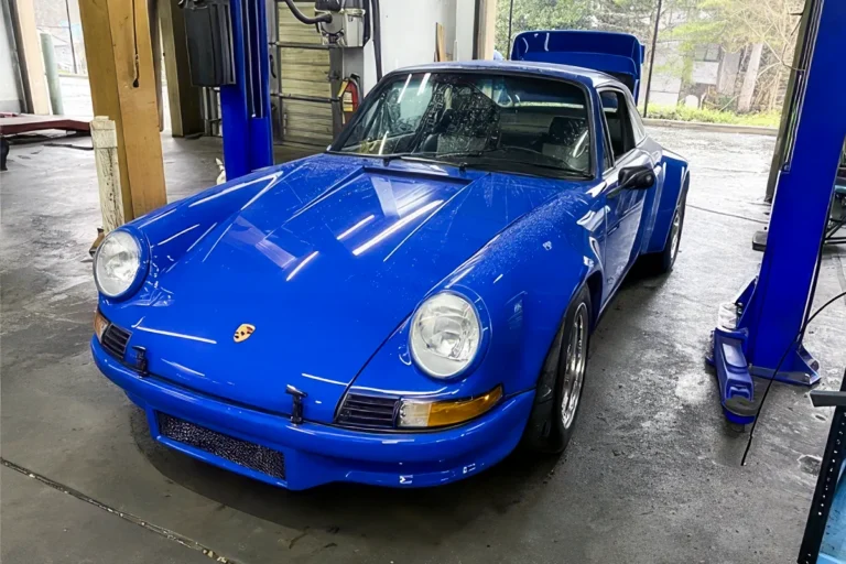 Blue air-cooled Porsche 911 in the RS Motorwerks shop for maintenance service